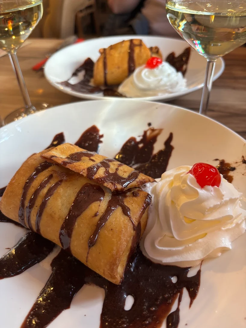 Mexican dessert with chocolate sauce, whipped cream and cherry at Fiesta Mexicana in Orpington